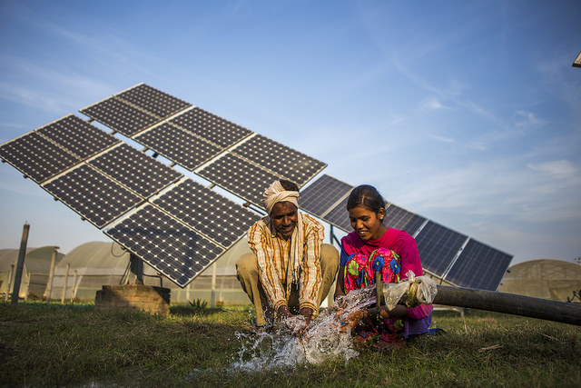 Farmer and his daughter both farm workers , use water pumped from a solar water pump at the farms of Gurinder Singh a farmer  Pic by Prashanth Vishwanathan (IWMI).