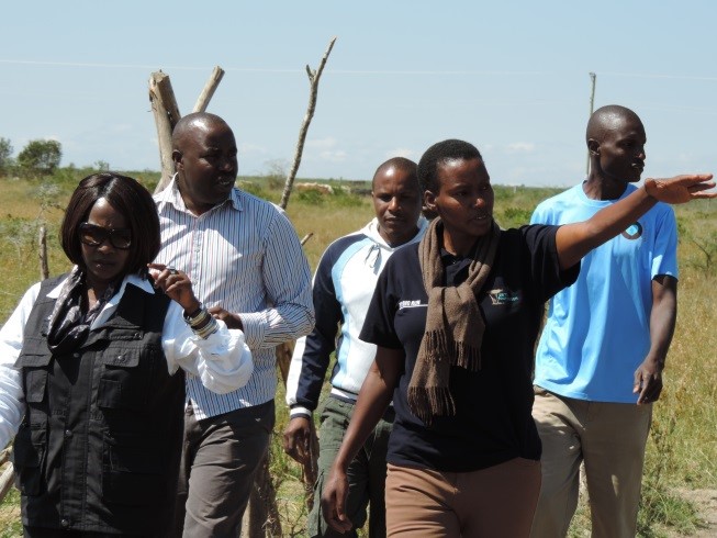 Patricia her colleagues with the CS-Environment and natural resources-Prof Judi Wakhungu on another project site Endana Secondary School, Segera.